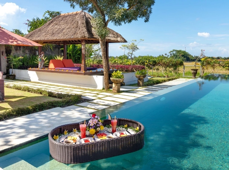 villa-gaya-asmara-ubud-bali-villas-retreats-floating fruits table drink swimming pool yoga area rice field view