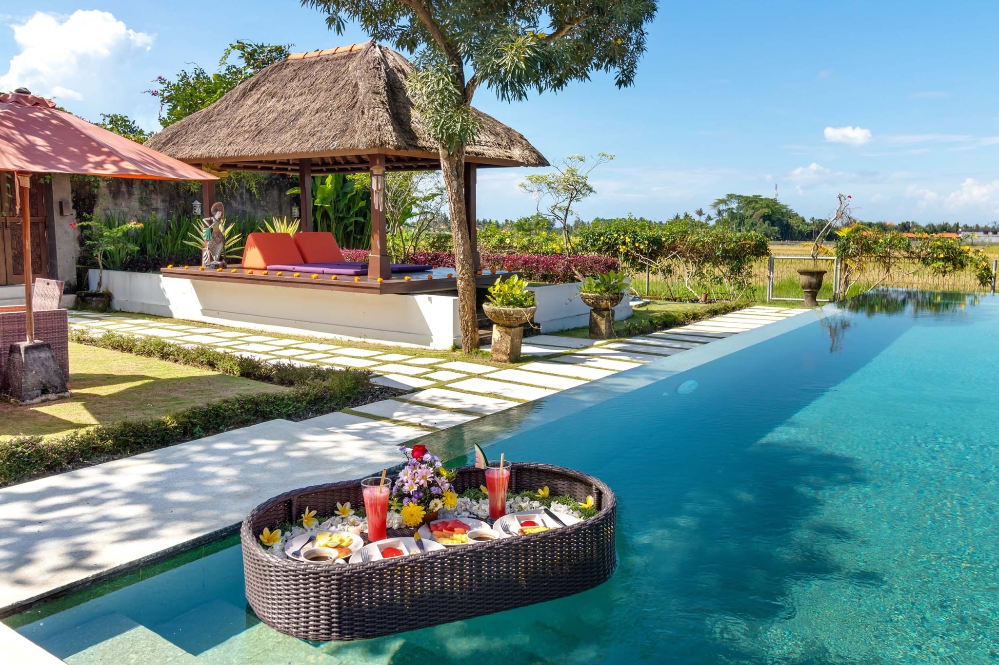 villa-gaya-asmara-ubud-bali-villas-retreats-floating fruits table drink swimming pool yoga area rice field view